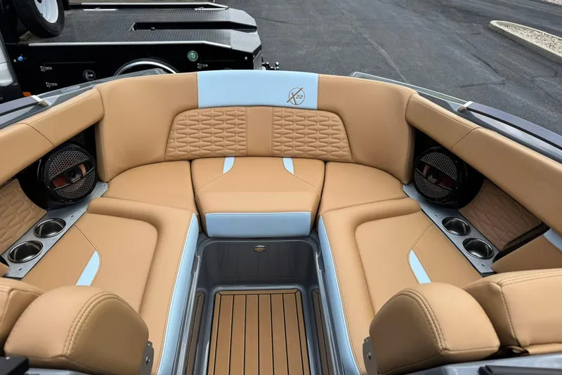 Slide: The Image of Luxurious interior of 2025 MasterCraft X22 boat with tan and blue seating. - 10