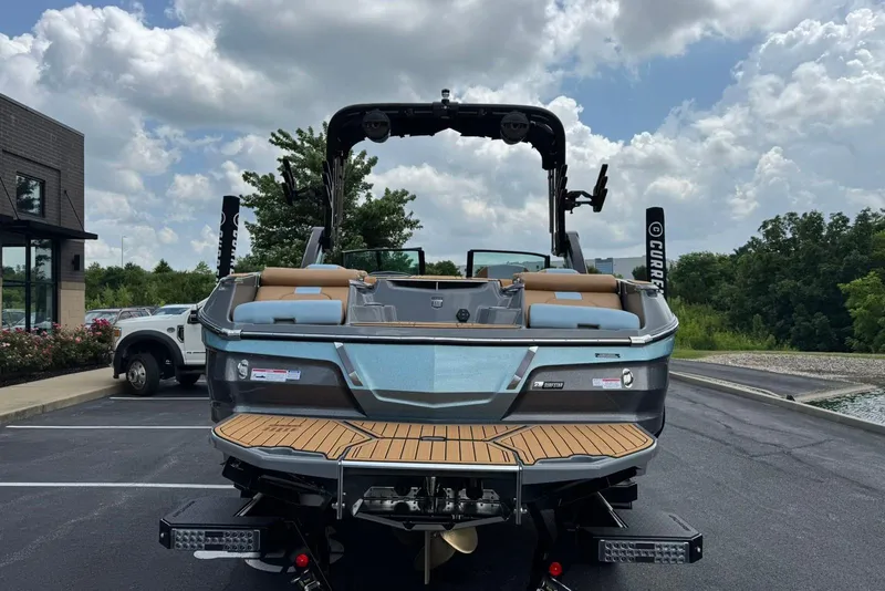 Slide: The Image of 2025 MasterCraft X22 boat parked outdoors, showcasing sleek design and modern features. - 6