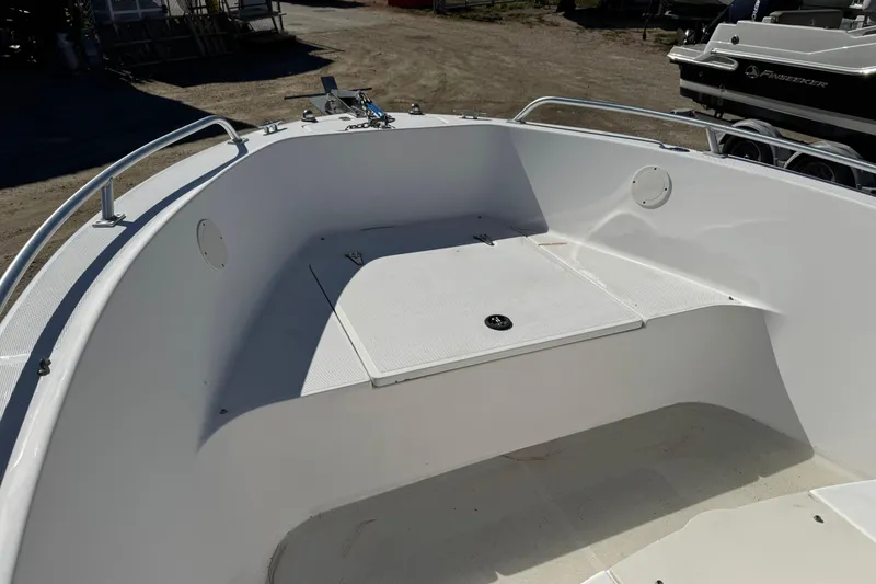 Slide: The Image of 2003 Mako 192 Center Console boat interior with storage compartment. - 2