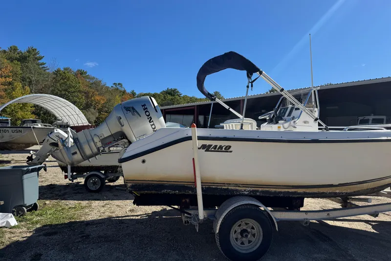 Slide: The Image of 2003 Mako 192 Center Console boat with Honda outboard motor on trailer. - 7
