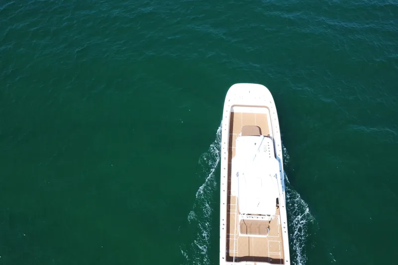 Slide: The Image of Aerial view of 2024 Invincible 46 Catamaran cruising on open water. - 35
