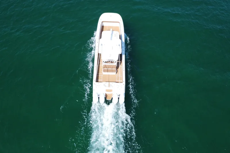 Slide: The Image of Aerial view of 2024 Invincible 46 Catamaran cruising on open water. - 36