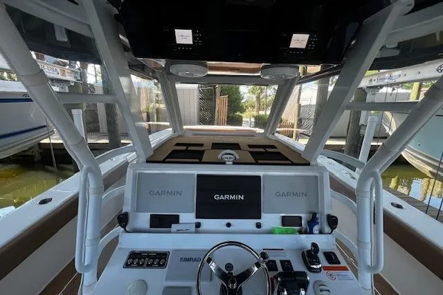 Slide: The Image of 2024 Invincible 46 Catamaran helm with Garmin navigation system and modern controls. - 53