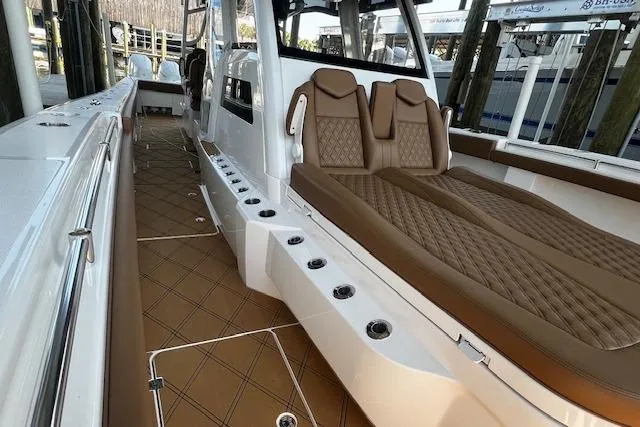 Slide: The Image of 2024 Invincible 46 Catamaran interior with luxurious seating and sleek design. - 61