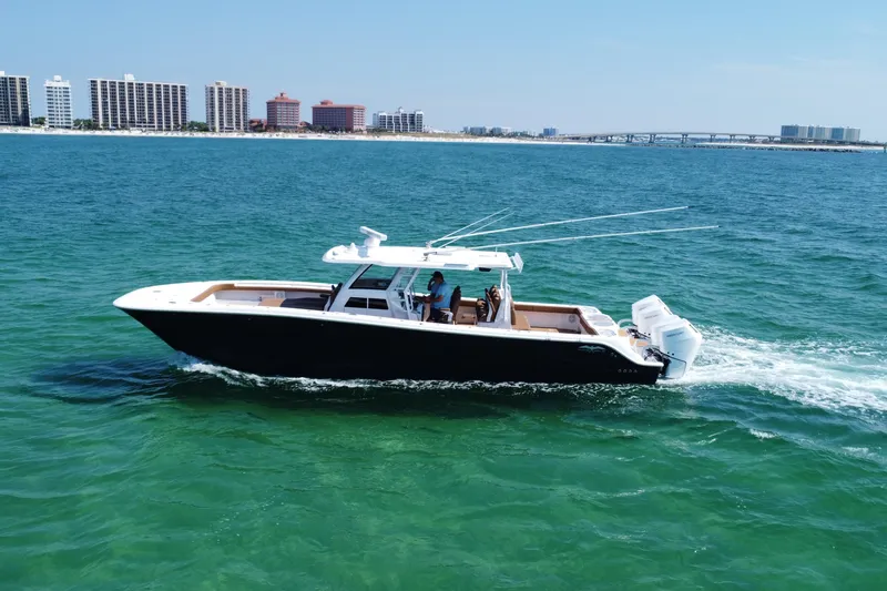 Slide: The Image of Manufacturer Provided Image: Top view layout of 2024 Invincible 46 Catamaran with labeled compartments. - 9