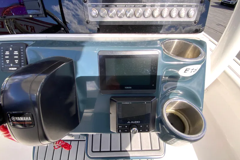 Slide: The Image of Control panel of 2022 Tidewater 2300 Carolina Bay boat with Yamaha and JL Audio systems. - 14