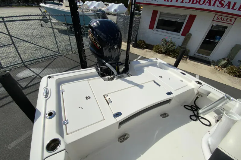 Slide: The Image of 2022 Tidewater 2300 Carolina Bay boat with outboard motor at sales lot. - 16