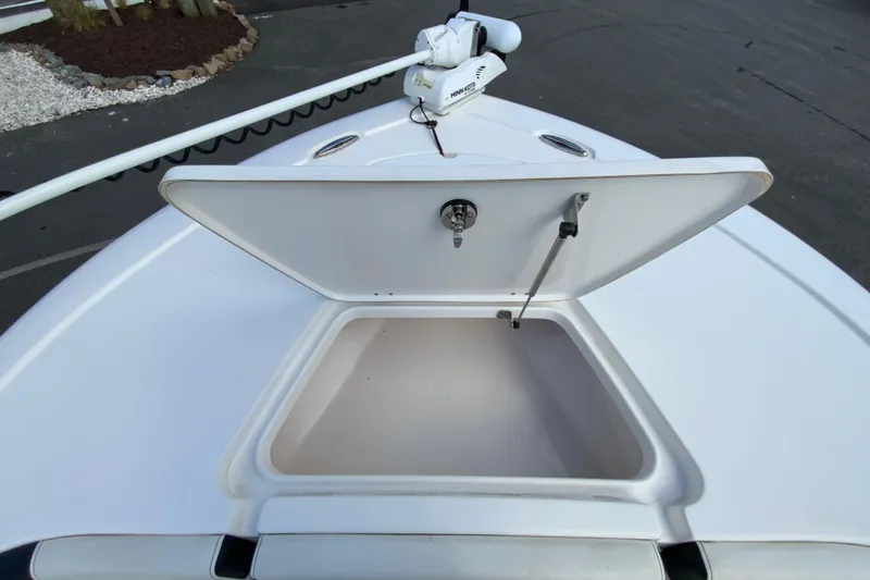 Slide: The Image of Open storage compartment on 2022 Tidewater 2300 Carolina Bay boat deck. - 22