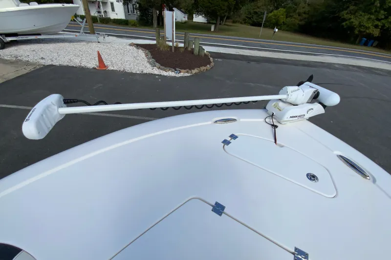 Slide: The Image of 2022 Tidewater 2300 Carolina Bay boat with Minn Kota trolling motor on deck. - 23