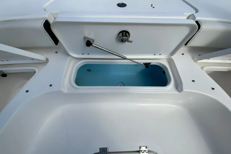 Slide: The Image of 2022 Tidewater 2300 Carolina Bay boat storage compartment with open hatch. - 27