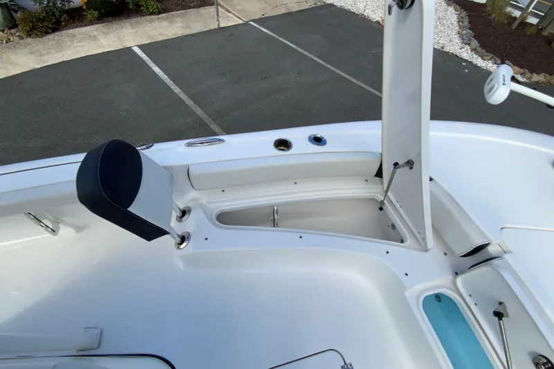 Slide: The Image of 2022 Tidewater 2300 Carolina Bay boat interior with open storage compartment. - 28