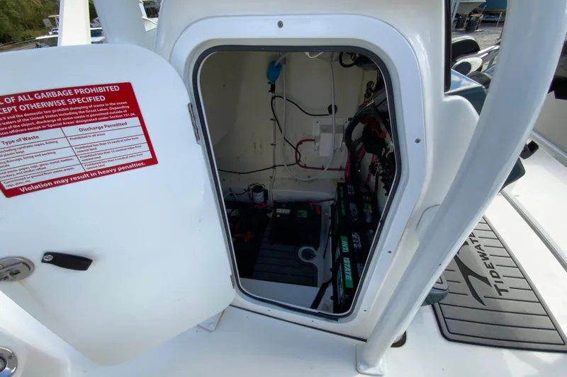 Slide: The Image of Interior view of 2022 Tidewater 2300 Carolina Bay boat's storage compartment with equipment. - 29