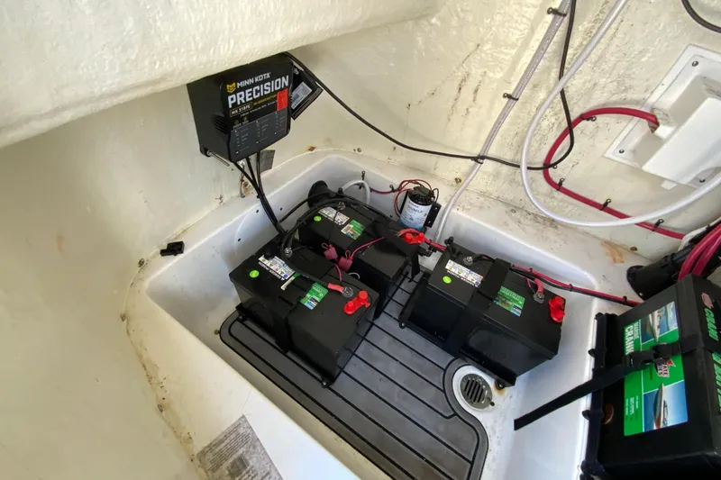 Slide: The Image of Battery compartment of 2022 Tidewater 2300 Carolina Bay with Minn Kota Precision charger. - 30