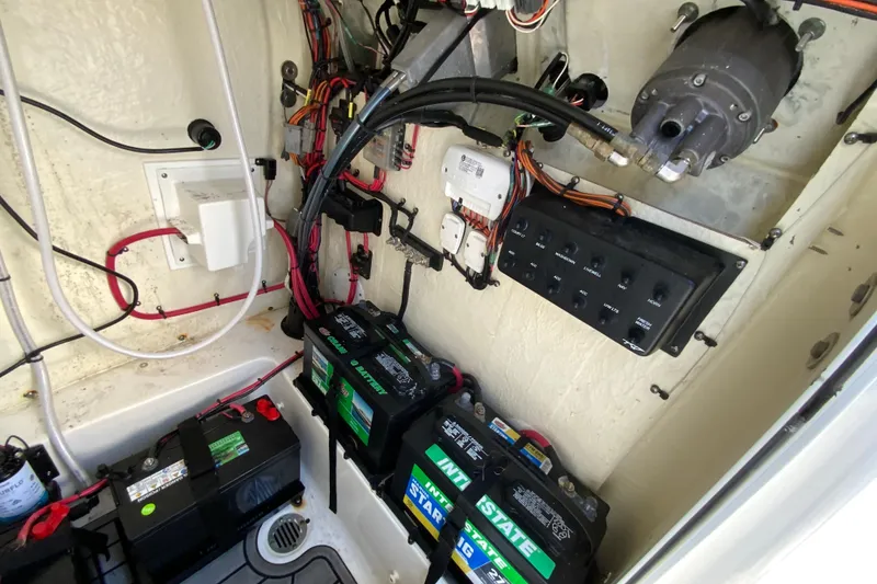 Slide: The Image of Electrical system of 2022 Tidewater 2300 Carolina Bay boat, featuring batteries and wiring. - 31