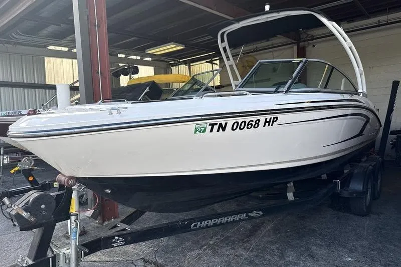 Slide: The Image of 2018 Chaparral 21 H2O Sport boat on trailer in covered storage. - 2