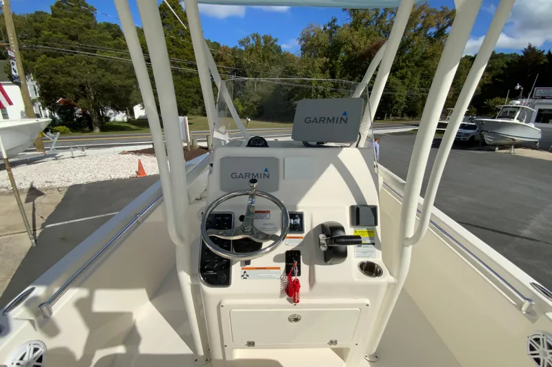 Slide: The Image of 2021 Cobia 220 Center Console boat dashboard with Garmin navigation system. - 12