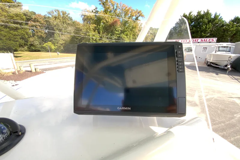 Slide: The Image of Garmin display on 2021 Cobia 220 Center Console boat, outdoor setting. - 14