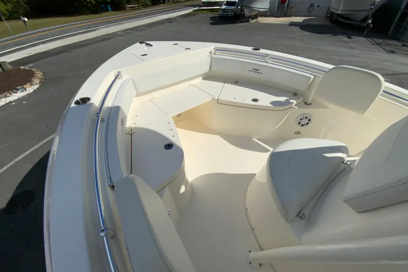 Slide: The Image of 2021 Cobia 220 Center Console boat interior with seating and storage compartments. - 24