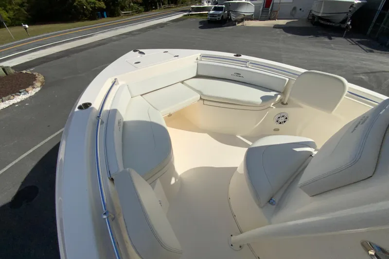 Slide: The Image of 2021 Cobia 220 Center Console boat with spacious seating and sleek design. - 26