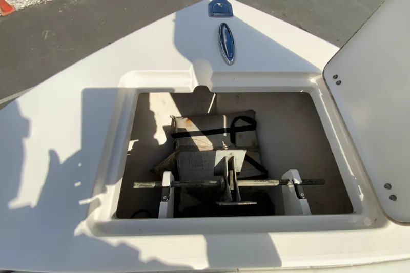 Slide: The Image of Anchor storage compartment on a 2021 Cobia 220 Center Console boat. - 29