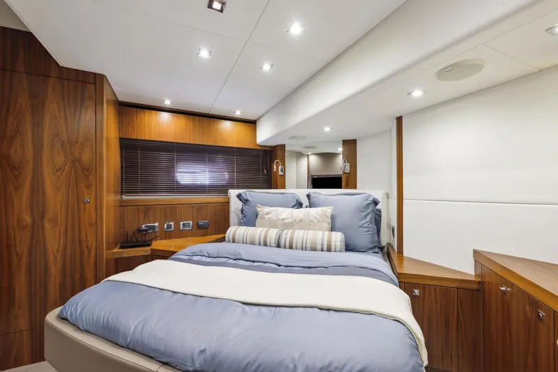 Slide: The Image of Luxurious bedroom interior of 2014 Sunseeker 73 Manhattan yacht with elegant wood finishes. - 31