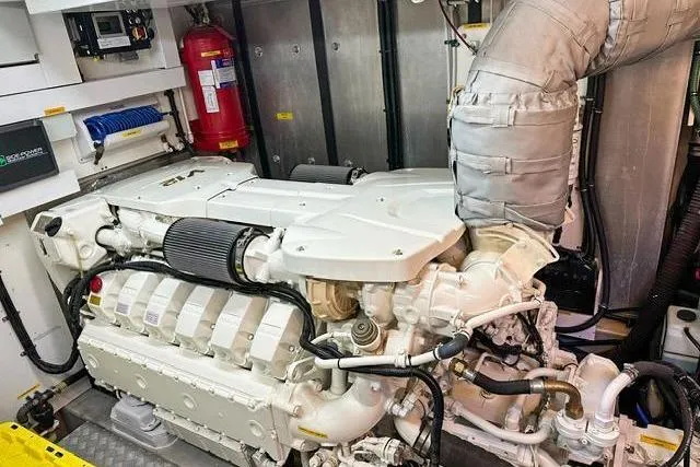 Slide: The Image of Engine room of 2014 Sunseeker 73 Manhattan yacht, featuring a powerful marine engine. - 41