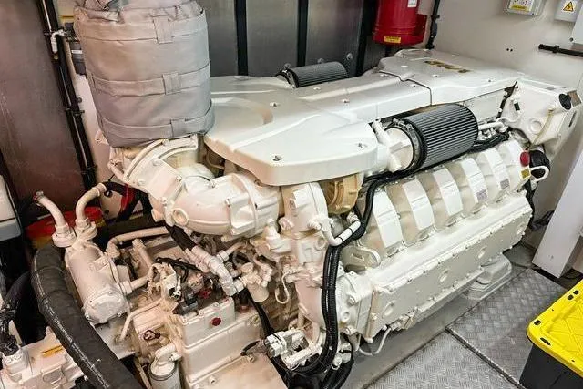 Slide: The Image of Engine room of 2014 Sunseeker 73 Manhattan yacht, showcasing powerful marine engine components. - 42