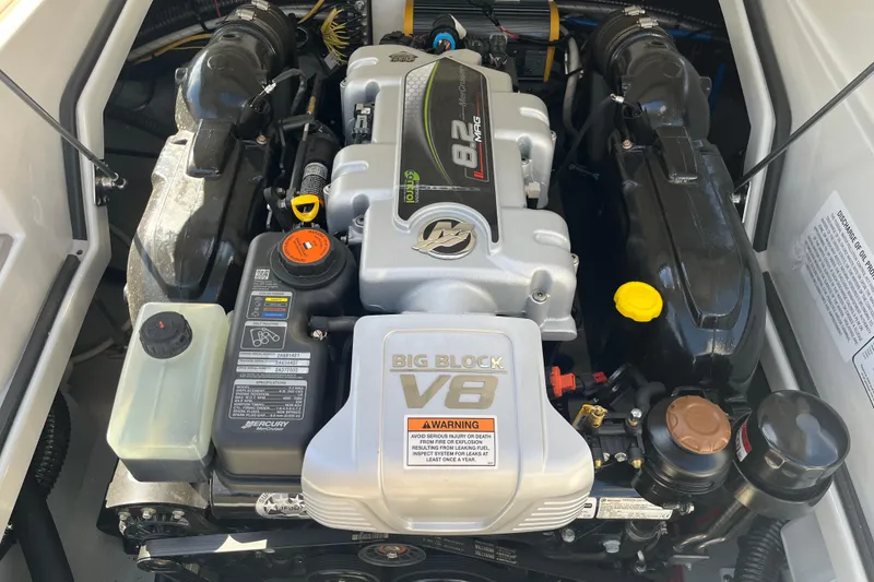 Slide: The Image of 2021 Crownline 290 SS engine compartment featuring a powerful Big Block V8 engine. - 14