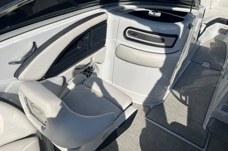 Slide: The Image of 2021 Crownline 290 SS boat interior with sleek seating and modern design. - 15