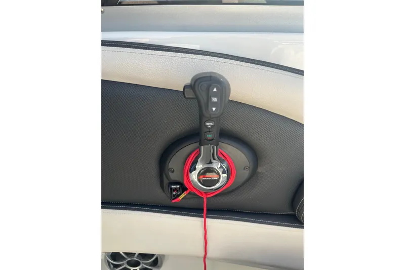 Slide: The Image of Throttle control on a 2021 Crownline 290 SS boat dashboard. - 20