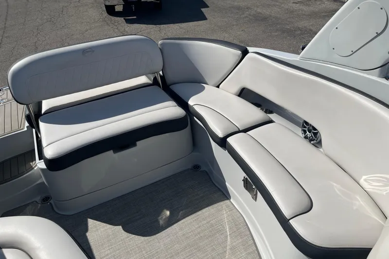 Slide: The Image of 2021 Crownline 290 SS boat interior with white leather seating and modern design. - 5