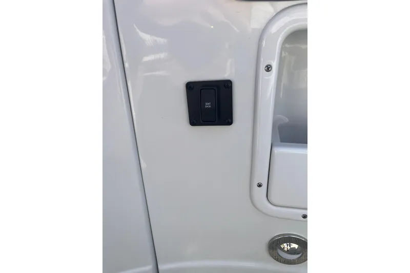 Slide: The Image of Switch panel on 2021 Crownline 290 SS boat interior. - 6