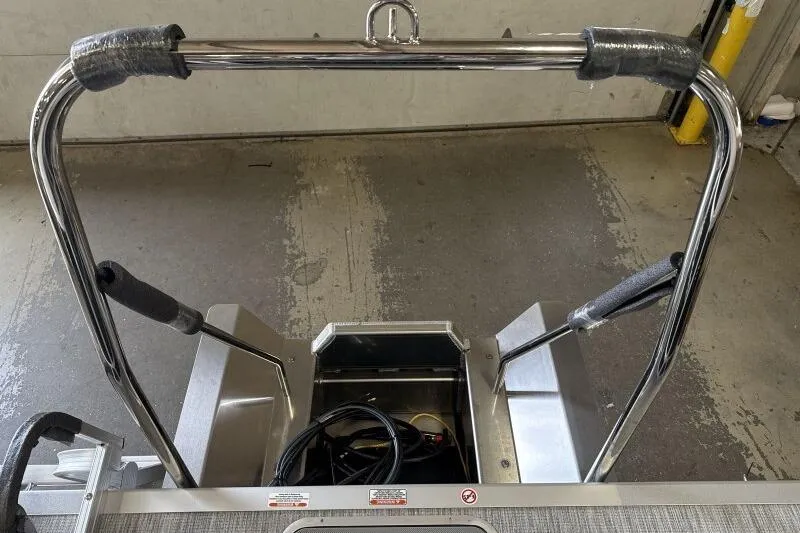 Slide: The Image of 2026 Bennington 22 SSRSF boat ladder and railing in a garage setting. - 16