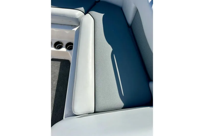 Slide: The Image of 2018 Moomba Helix boat interior seating with gray and white upholstery. - 11