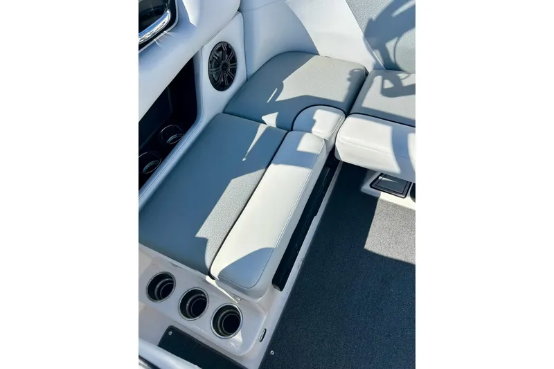 Slide: The Image of Interior seating of a 2018 Moomba Helix boat with gray upholstery and cup holders. - 20