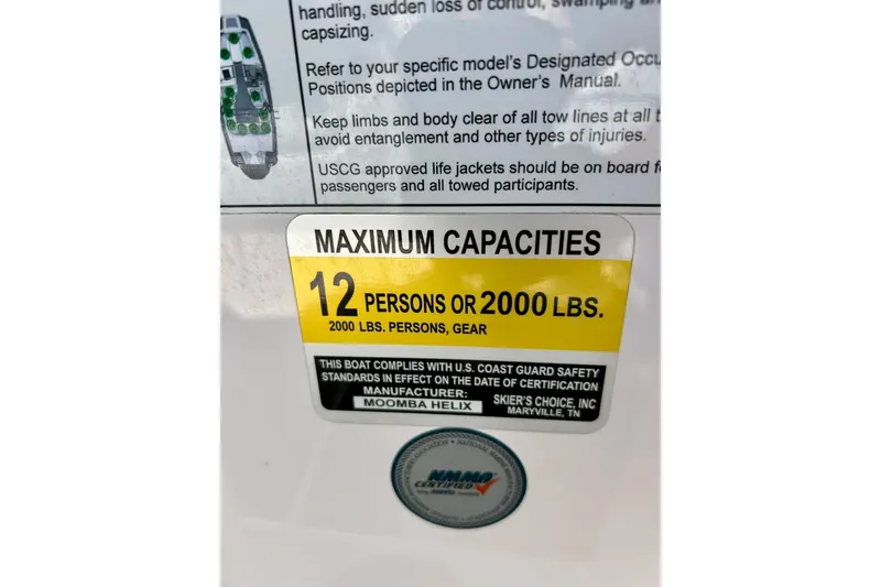Slide: The Image of 2018 Moomba Helix capacity label: 12 persons or 2000 lbs, USCG compliant. - 21