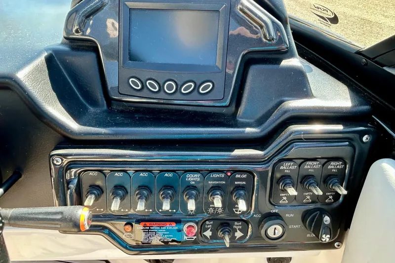 Slide: The Image of 2018 Moomba Helix dashboard with control switches and display screen. - 29