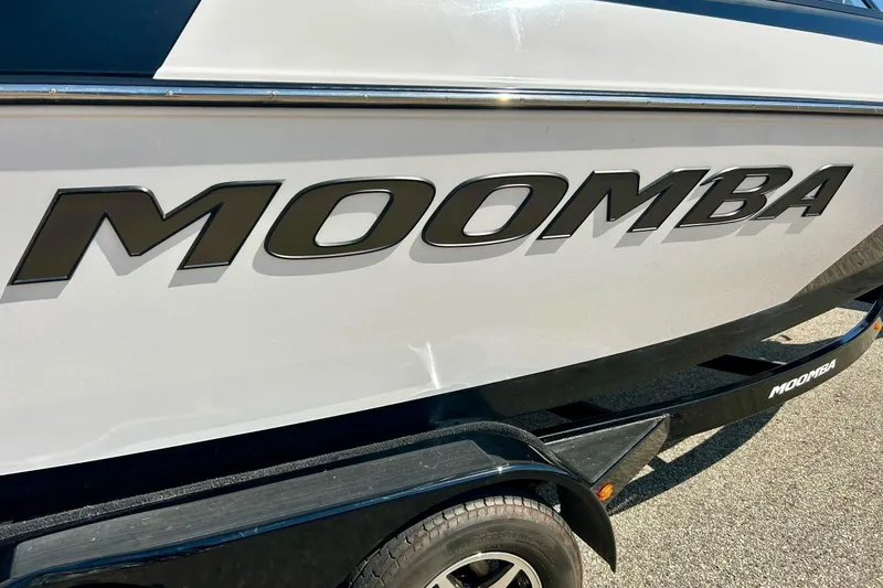 Slide: The Image of 2018 Moomba Helix boat side view with logo and trailer. - 4