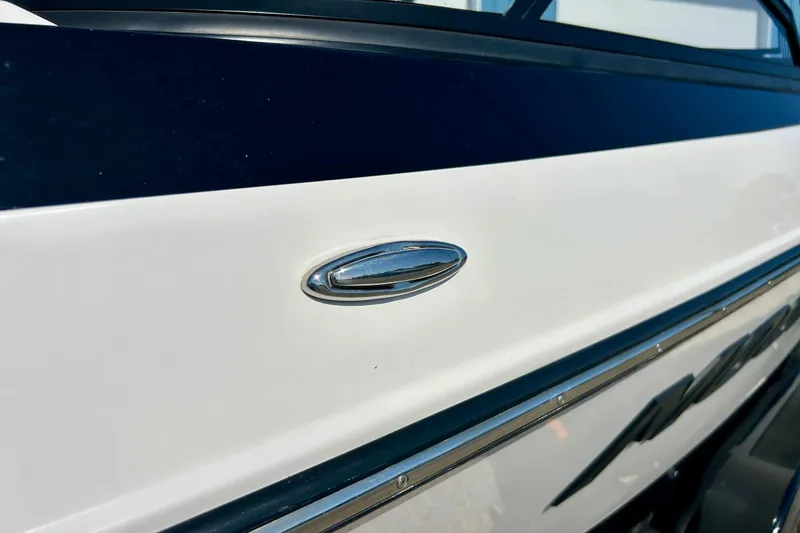 Slide: The Image of 2018 Moomba Helix boat side view with sleek chrome detailing. - 46