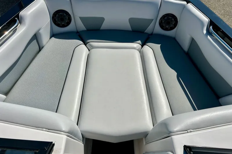 Slide: The Image of 2018 Moomba Helix boat interior with gray seating and built-in speakers. - 9
