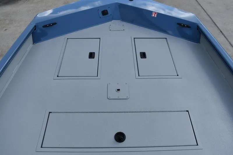 Slide: The Image of Deck of 2026 Lowe Roughneck RX2070 CC boat with storage compartments. - 14