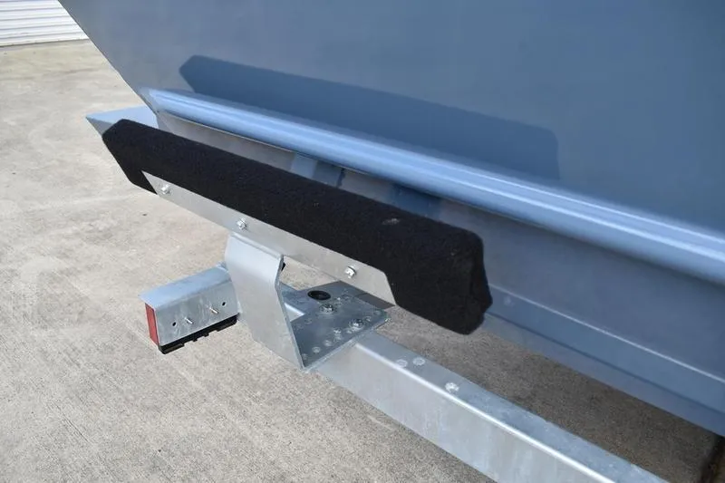 Slide: The Image of 2026 Lowe Roughneck RX2070 CC boat storage compartments, open and empty. - 15