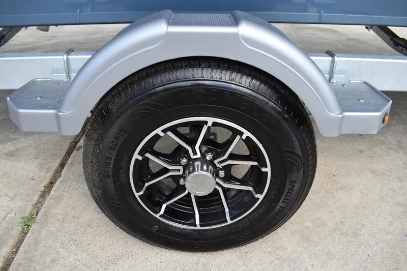 Slide: The Image of Interior of 2026 Lowe Roughneck RX2070 CC boat showing storage compartments and handle. - 20