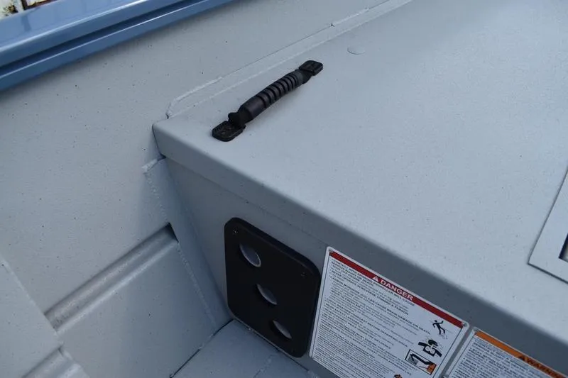 Slide: The Image of 2026 Lowe Roughneck RX2070 CC boat interior with seating and storage compartments. - 22