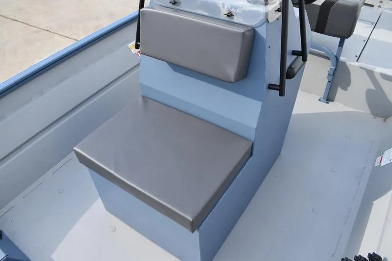 Slide: The Image of Interior view of 2026 Lowe Roughneck RX2070 CC boat, featuring rod holders and storage. - 23