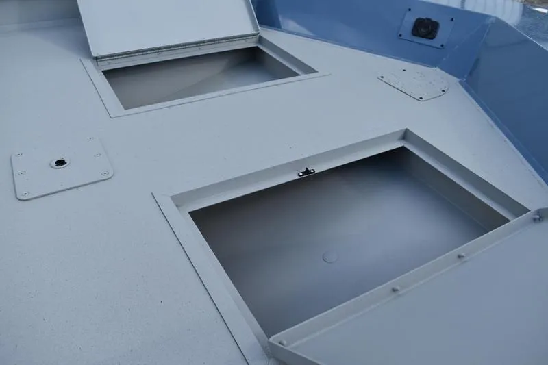 Slide: The Image of Open storage compartment on 2026 Lowe Roughneck RX2070 CC boat. - 25