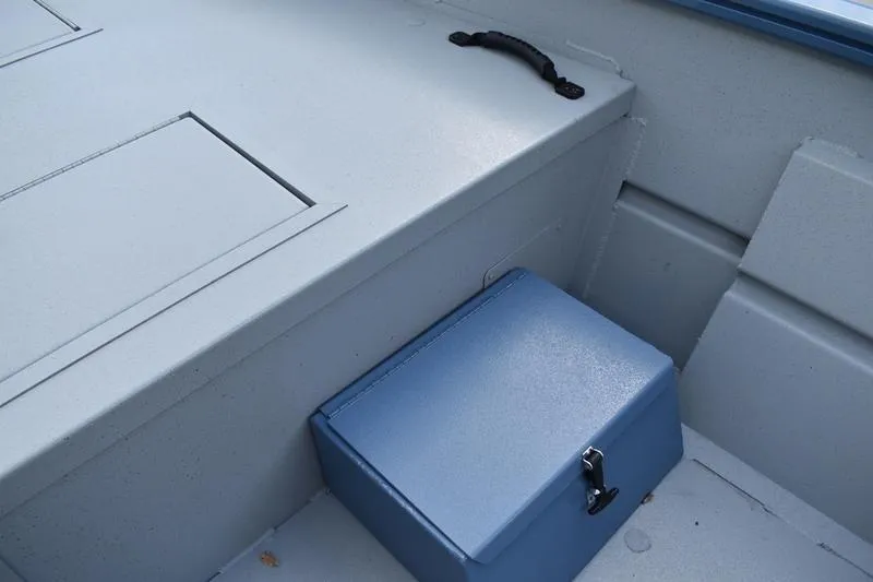 Slide: The Image of 2026 Lowe Roughneck RX2070 CC boat interior with steering console and seating. - 26