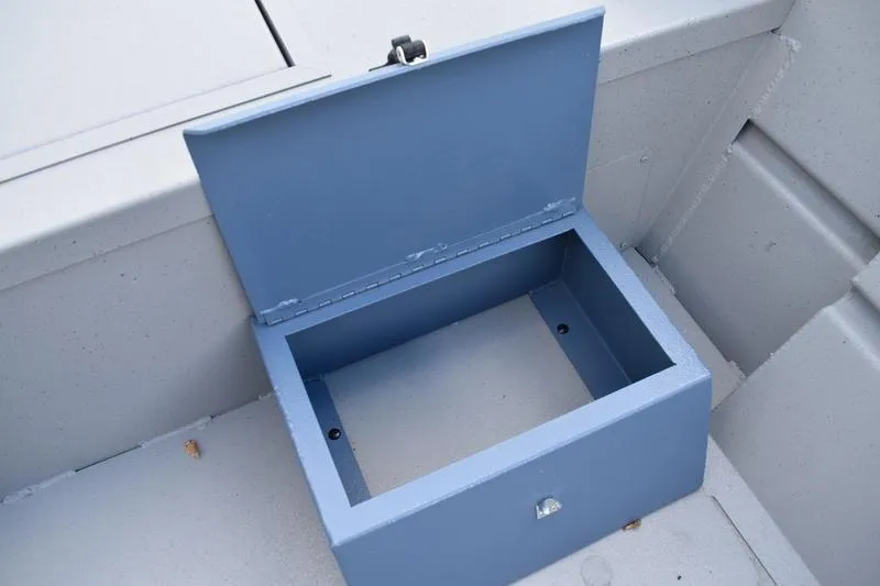 Slide: The Image of 2026 Lowe Roughneck RX2070 CC boat detail with black handle on blue surface. - 27