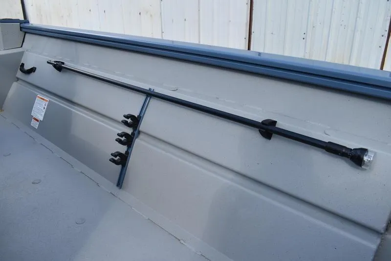 Slide: The Image of 2026 Lowe Roughneck RX2070 CC boat interior with gray seating and sturdy metal frame. - 29