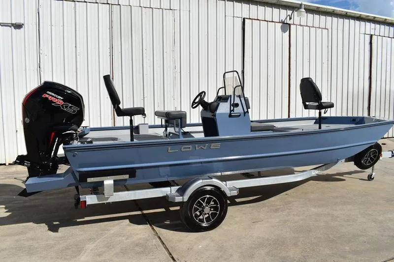 Slide: The Image of 2026 Lowe Roughneck RX2070 CC boat transom with motor mount and trailer detail. - 3